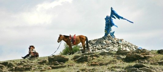 Mongolian Man With Horse And Ovoo